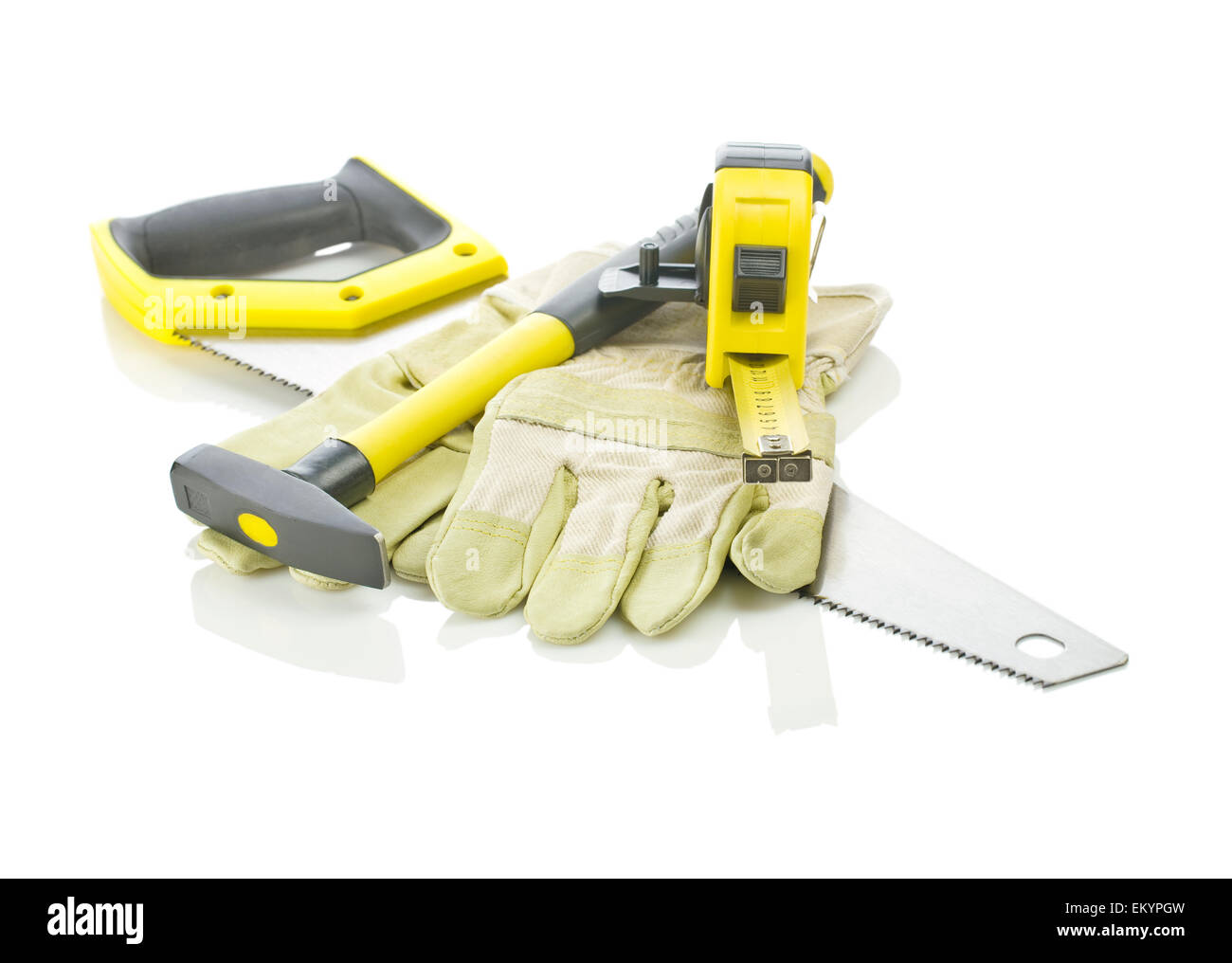 tapeline, hammer and gloves on saw Stock Photo
