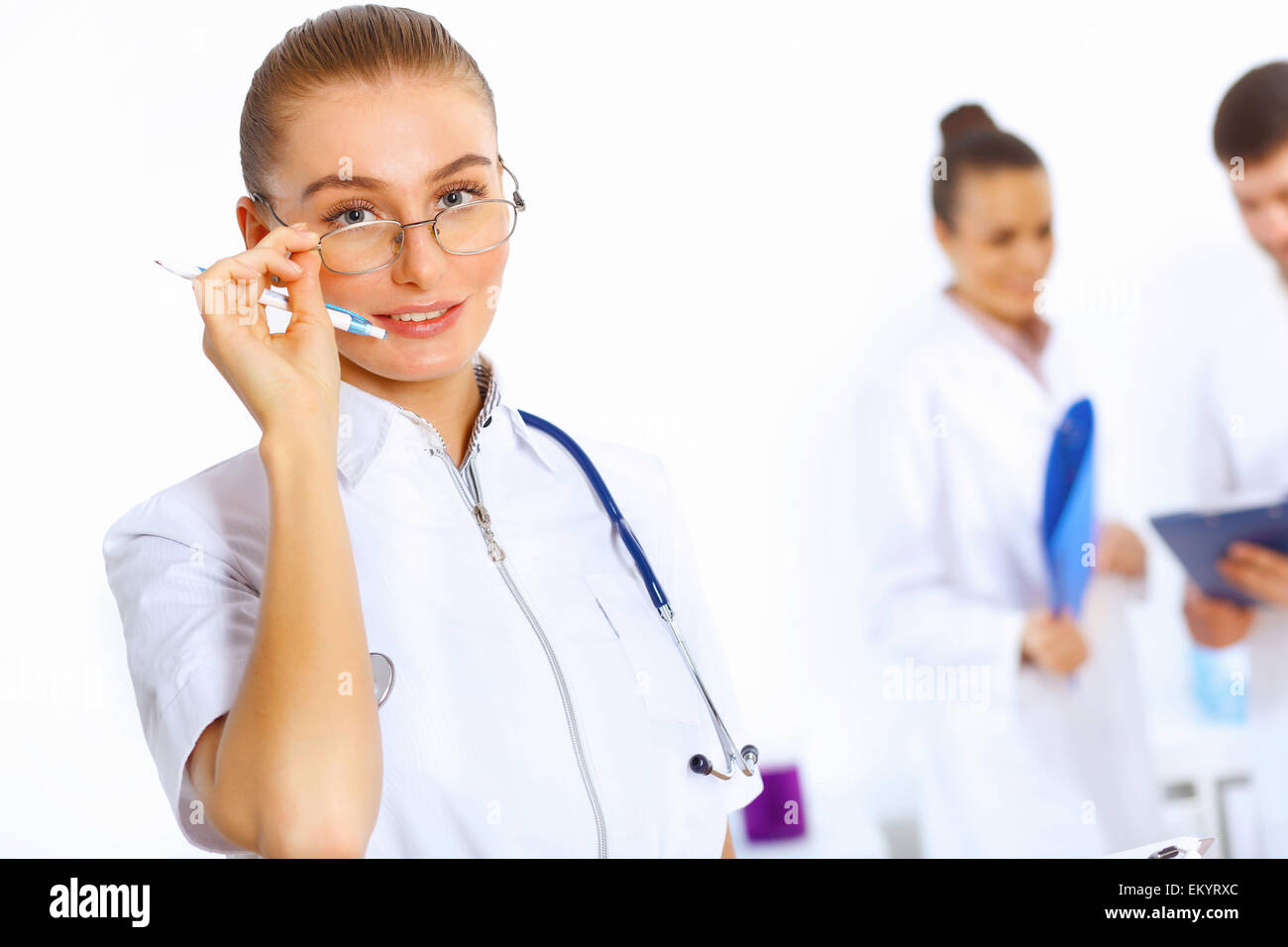 Young female doctor in white uniform Stock Photo - Alamy