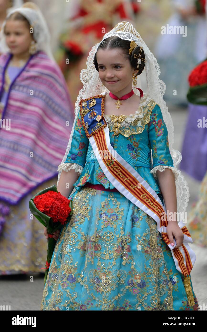 Fallas festival, girl in a traditional costume during the parade in the Plaza de la Virgen de los Desamparados, Valencia, Spain Stock Photo