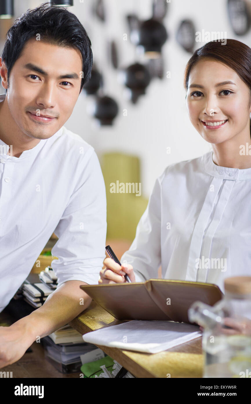 Wait staff standing in restaurant Stock Photo Alamy