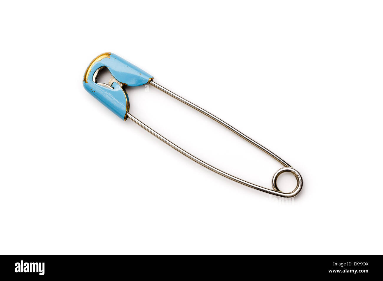 Old safety pin or needle of metal. Isolated on a white background. Used and has wear Stock Photo