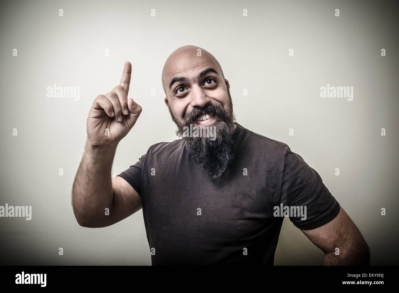 smiling pointing bearded man Stock Photo