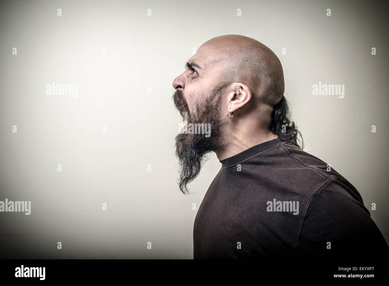 profile screaming angry bearded man Stock Photo