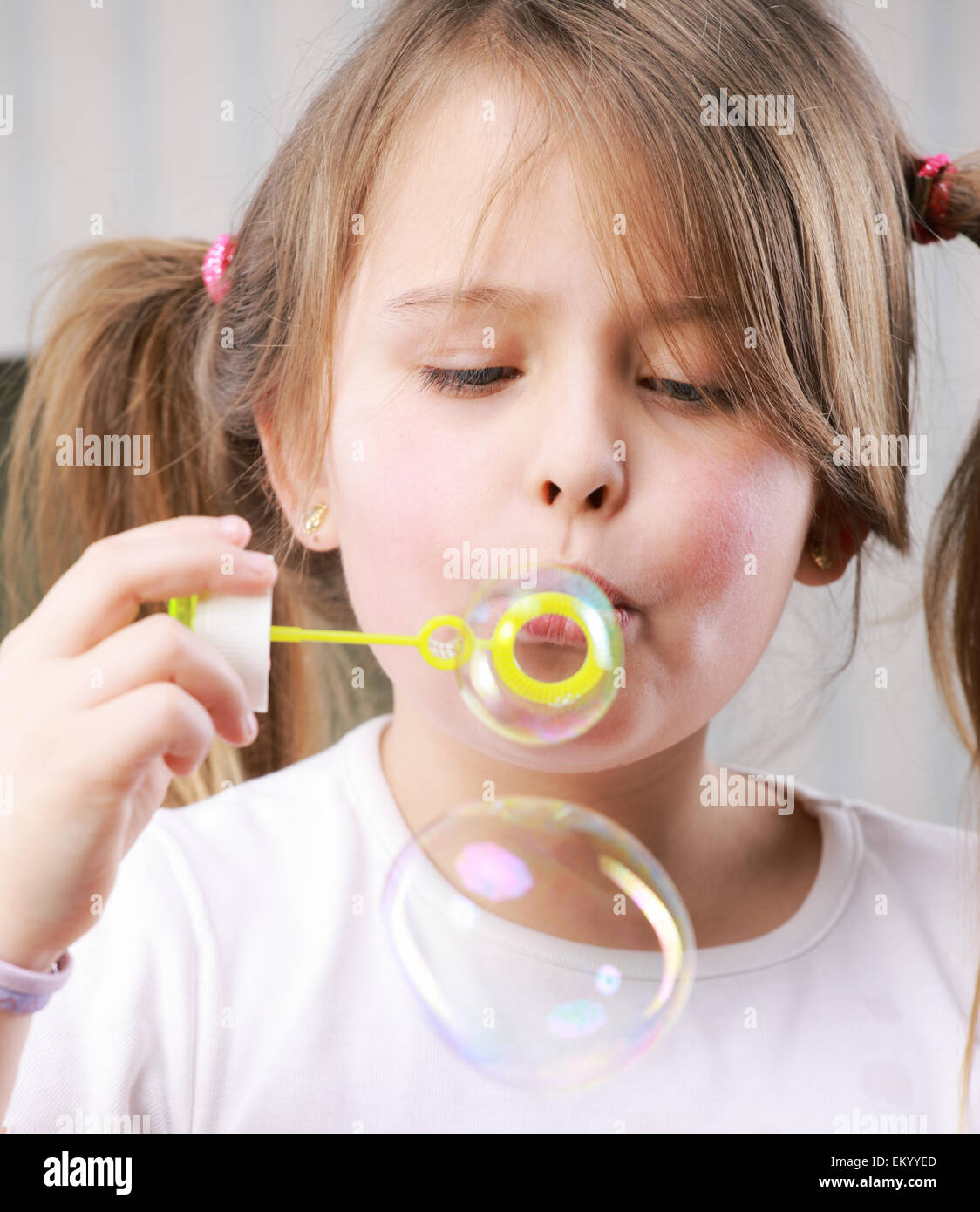 Little girll blowing bubbles Stock Photo Alamy