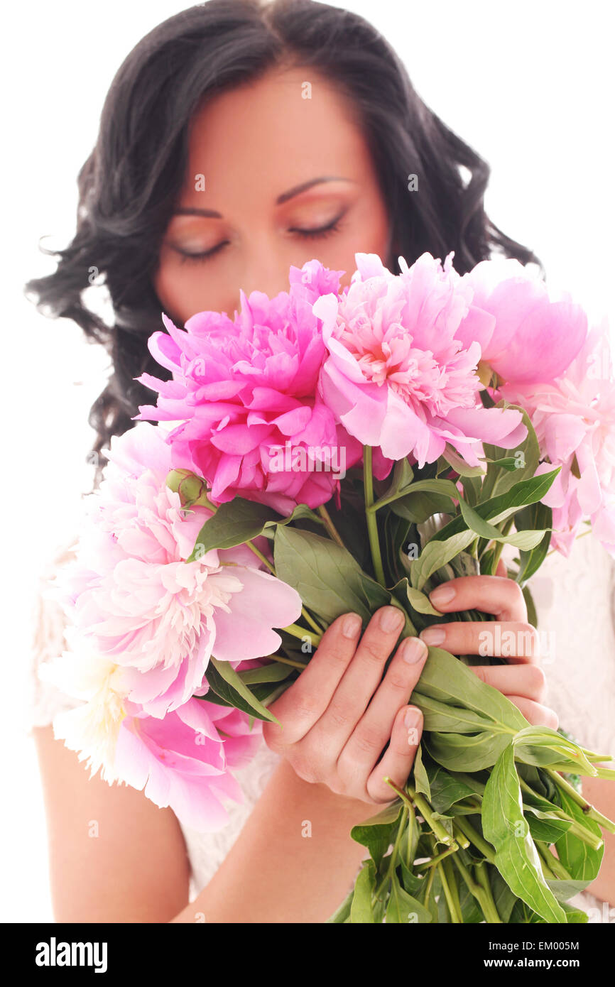 Beautiful young woman with bouquet of peonies Stock Photo - Alamy