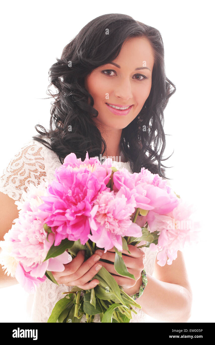 Beautiful young woman with bouquet of peonies Stock Photo - Alamy