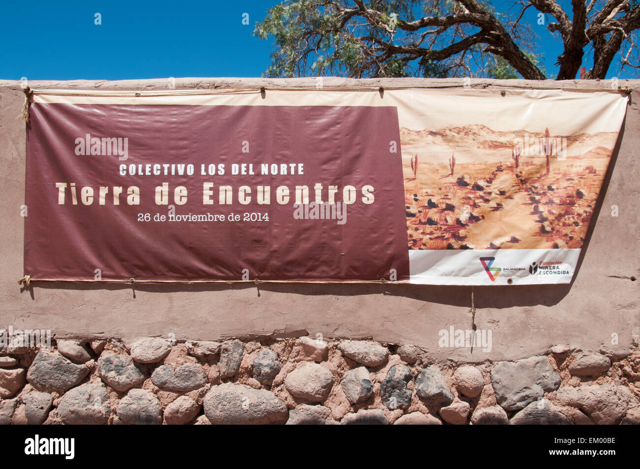 Signs announce cultural events sponsored in part by Fundacion Minera Escondida in San Pedro de Atacama, northern Chile Stock Photo