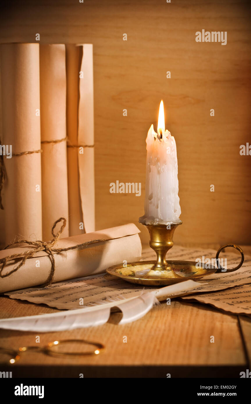 antic candle with rool of paper Stock Photo