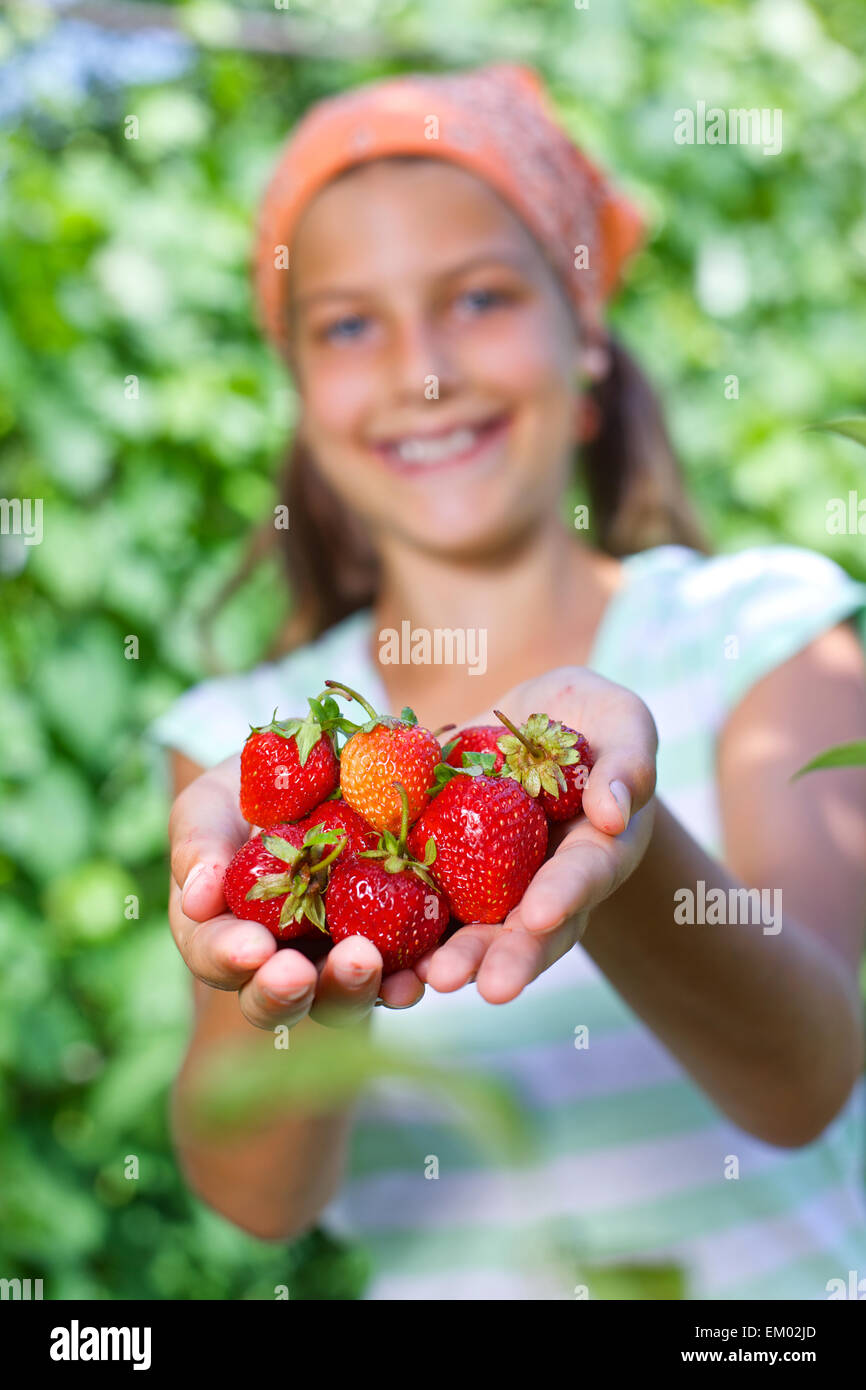 Girl holding a tomatoes Stock Photo - Alamy