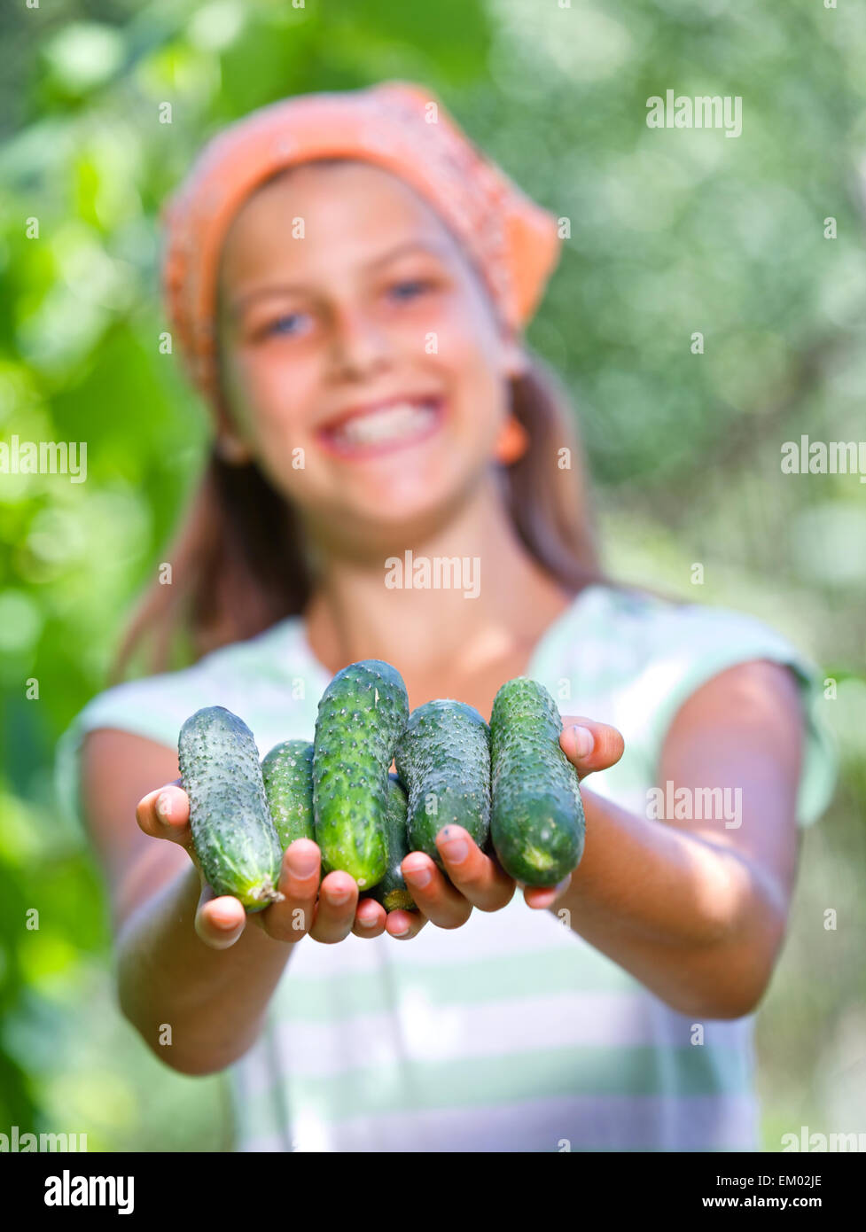 Girl holding a tomatoes Stock Photo - Alamy