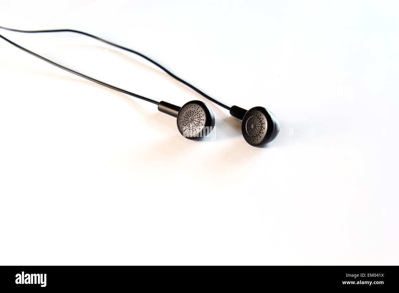 Black earphones on white Stock Photo Alamy