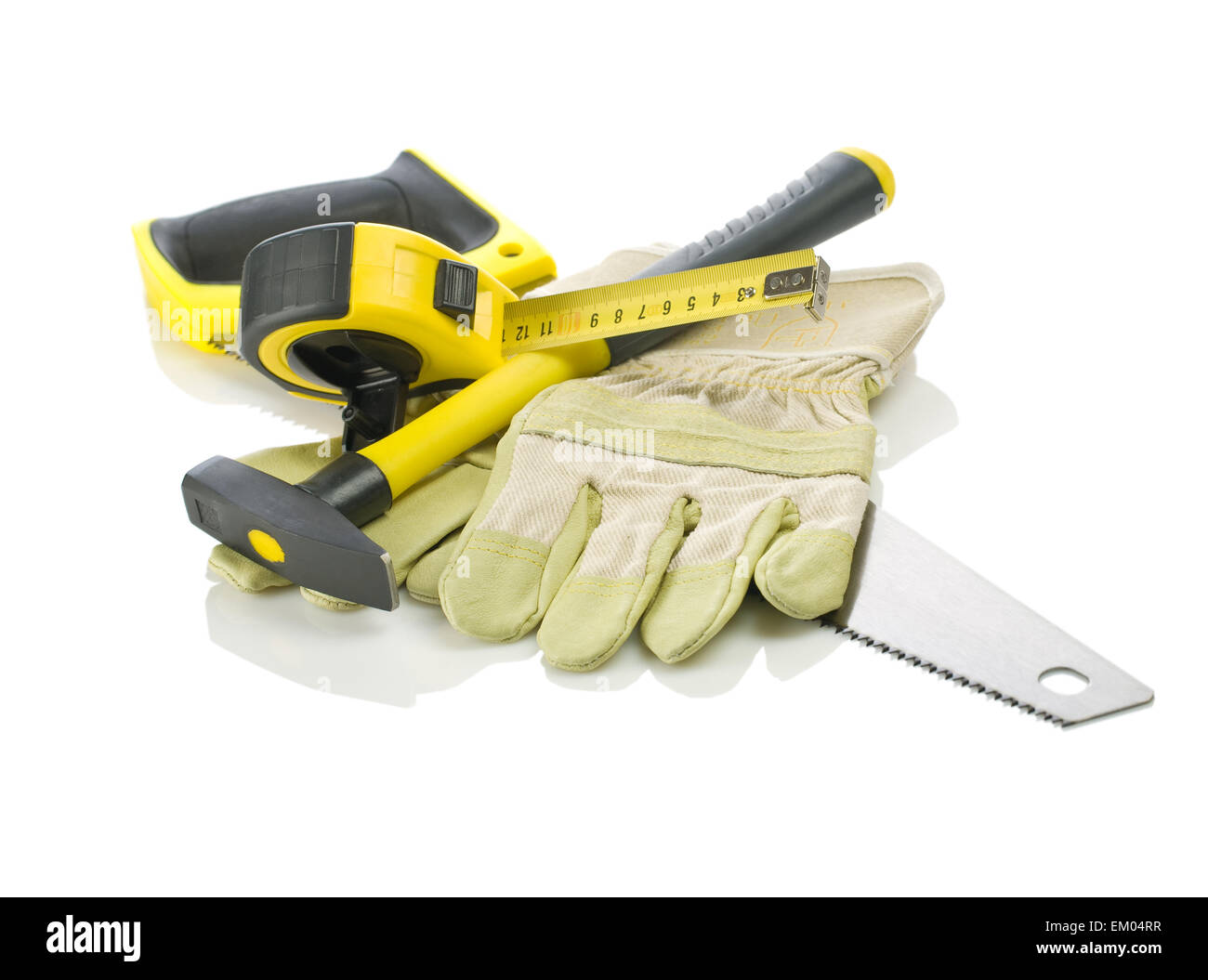 Gloves, tapeline, saw and hammer Stock Photo