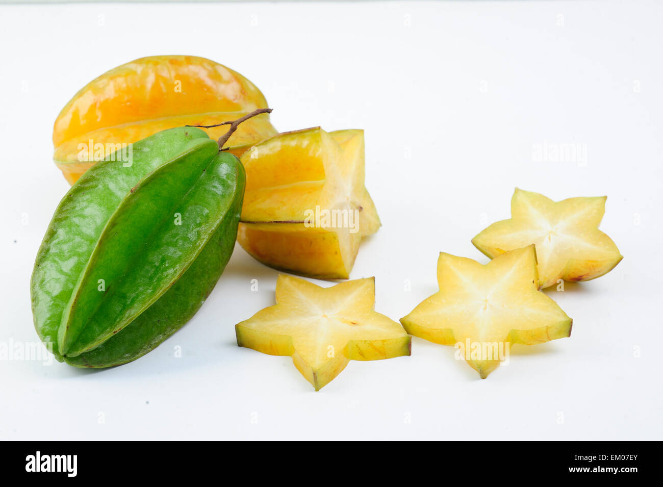 Carambola fruit with slices isolated on white background Stock Photo