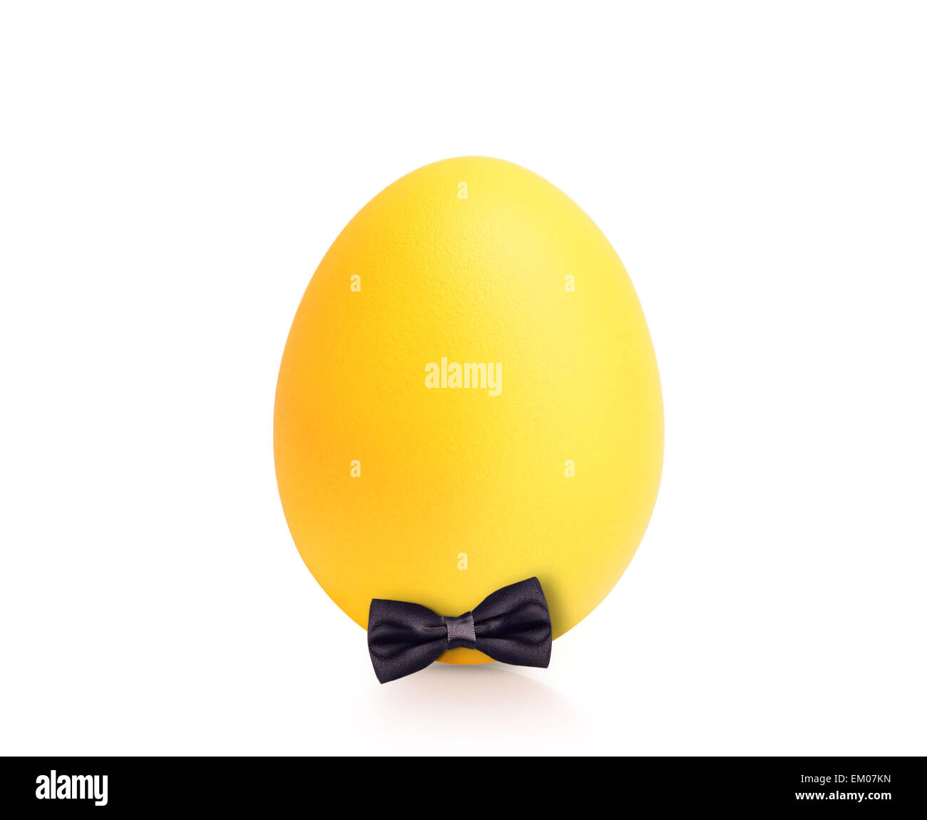 yellow egg isolated on white with bow tie Stock Photo Alamy