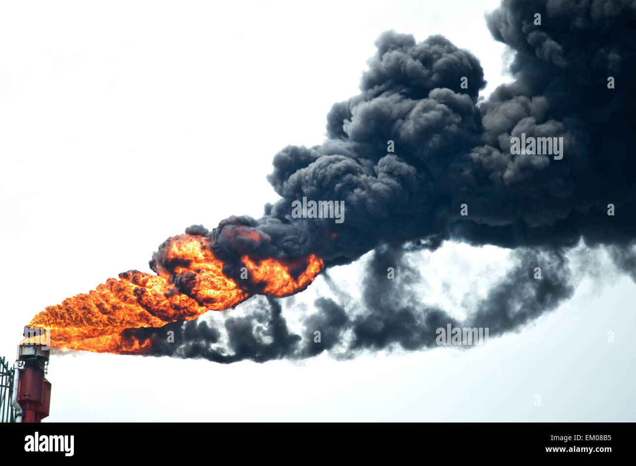 Heavy smoke from industrial chimney polluting the environment Stock Photo