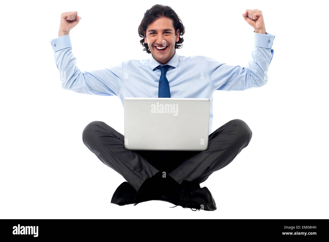 Excited young professional with laptop Stock Photo - Alamy
