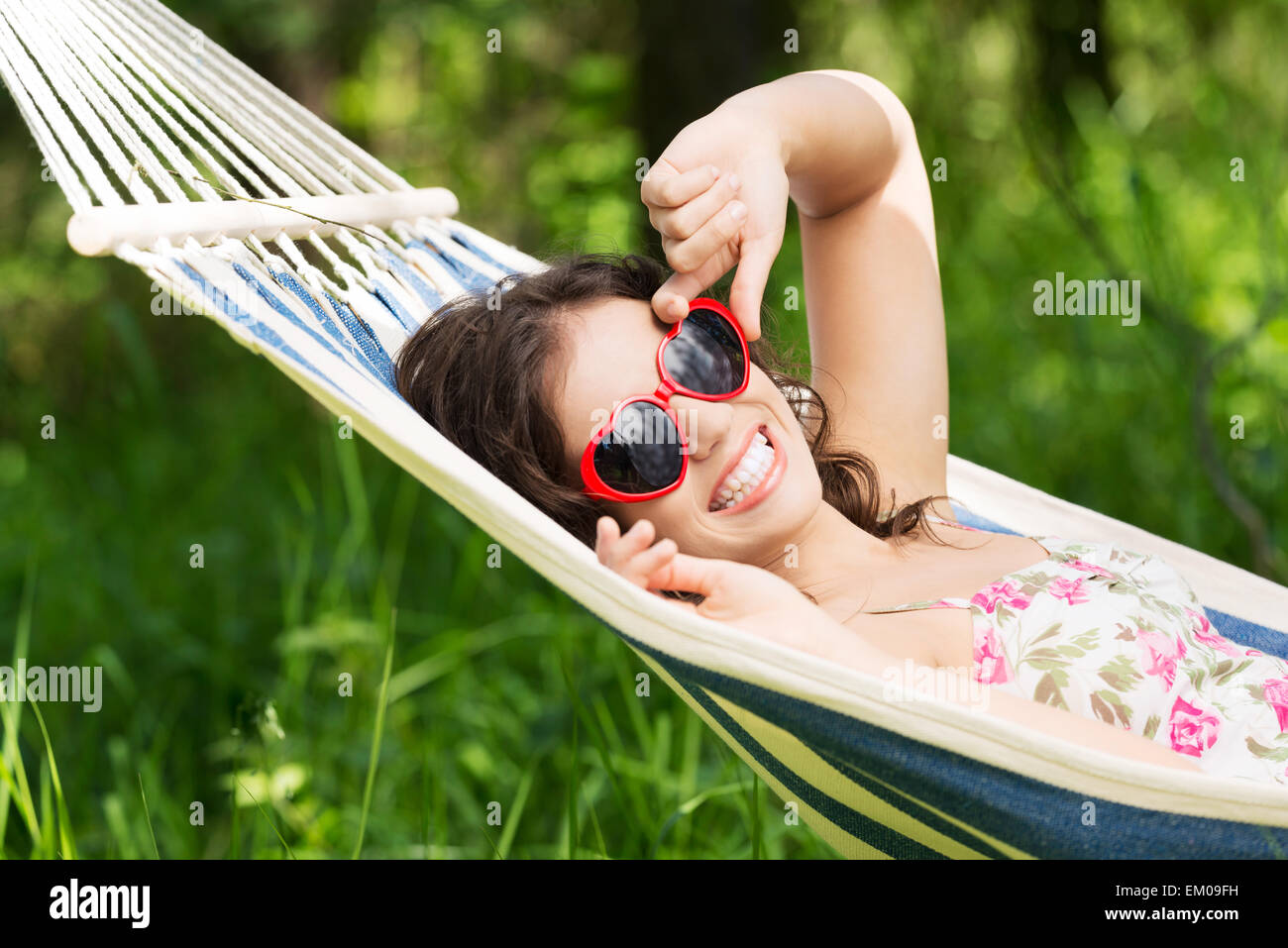 Young woman lying in a hammock Stock Photo Alamy