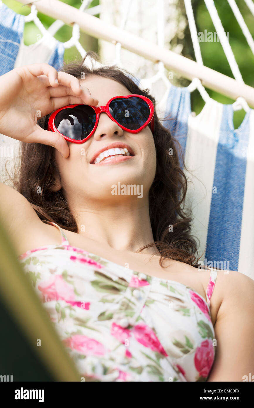 Young woman lying in a hammock Stock Photo - Alamy