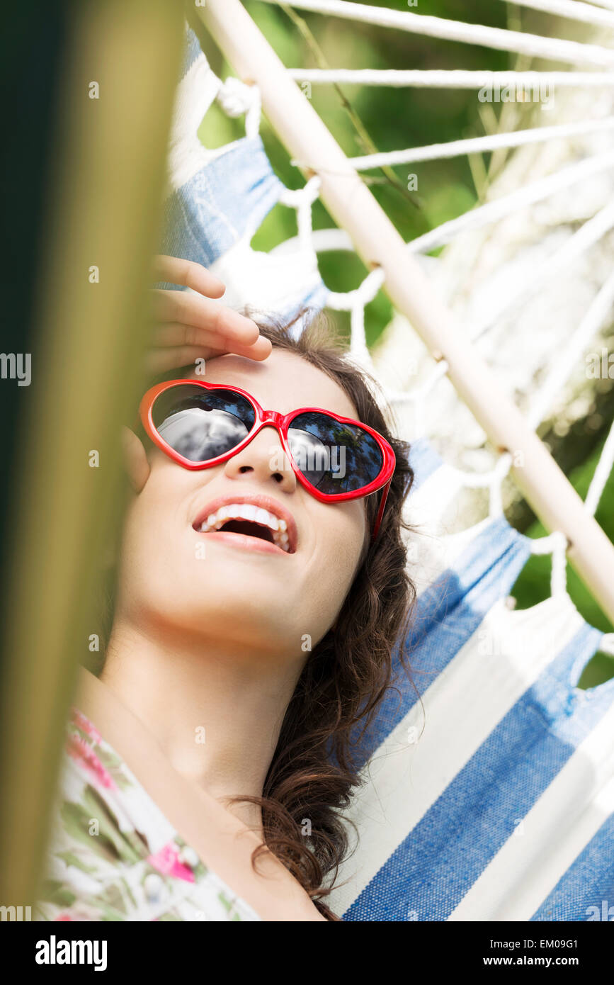 Young woman lying in a hammock Stock Photo - Alamy