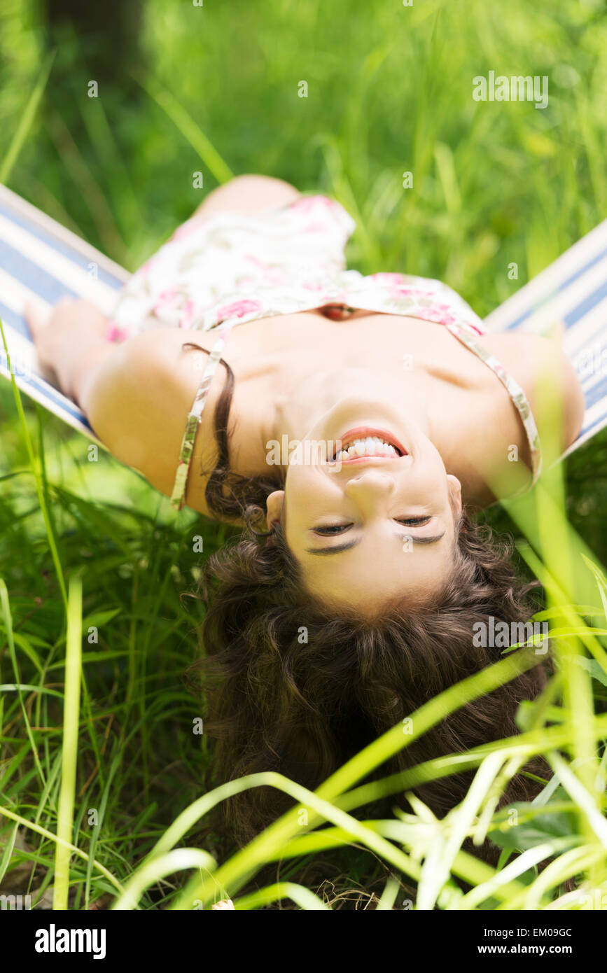 Young woman lying in a hammock Stock Photo - Alamy