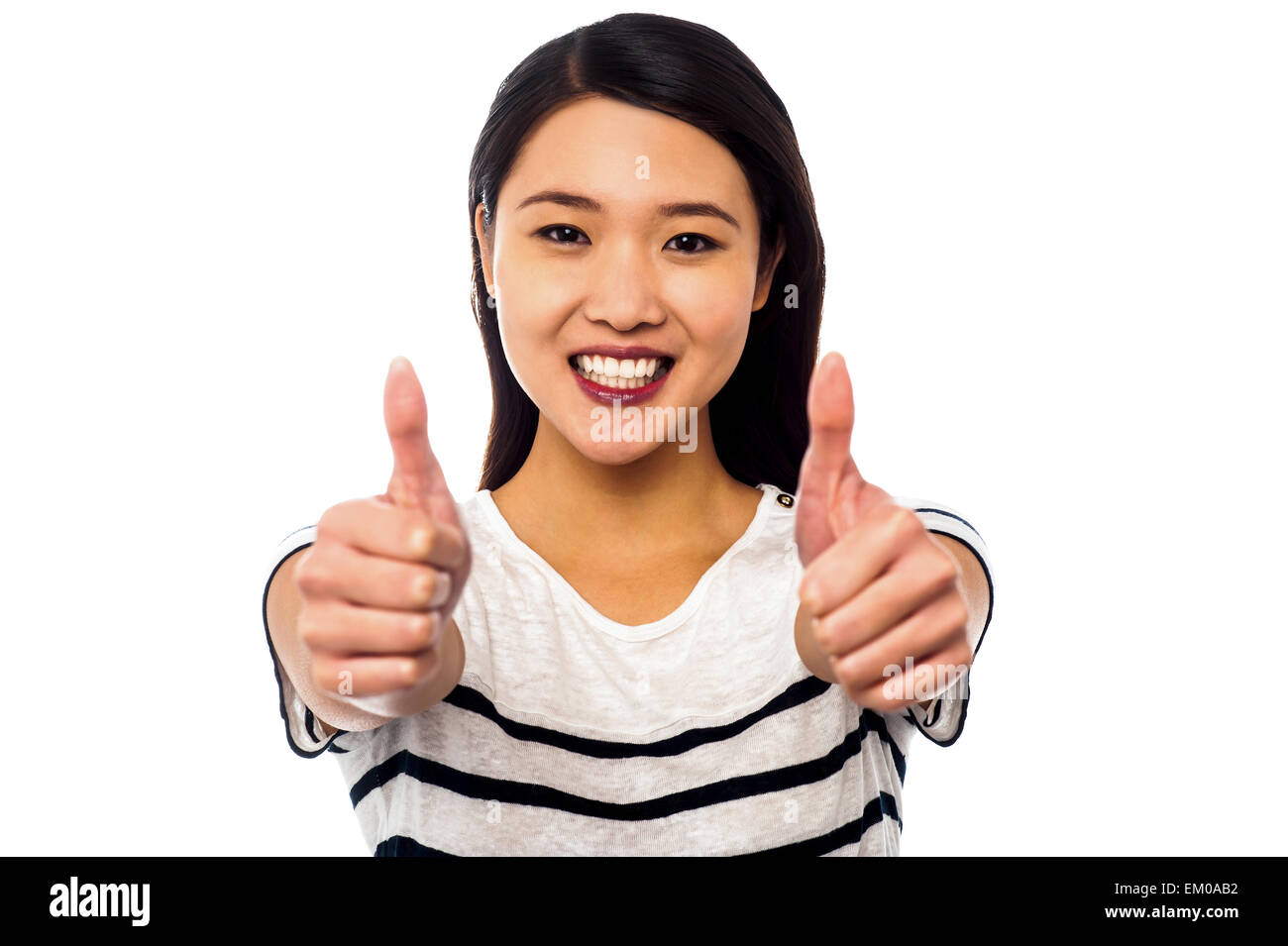 Attractive girl showing double thumbs up Stock Photo - Alamy