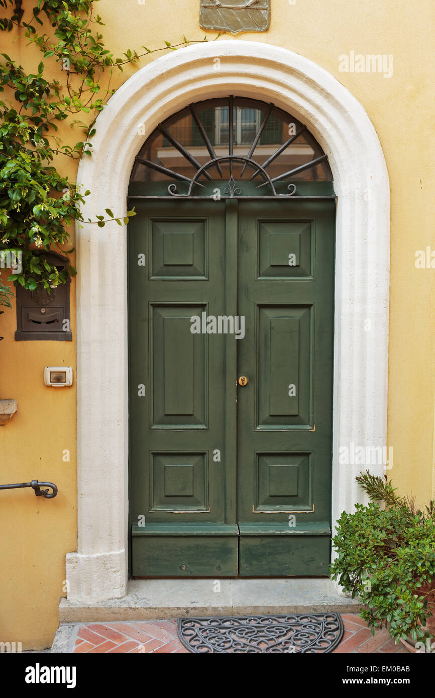 Old wooden door in a stone house Italian Stock Photo - Alamy