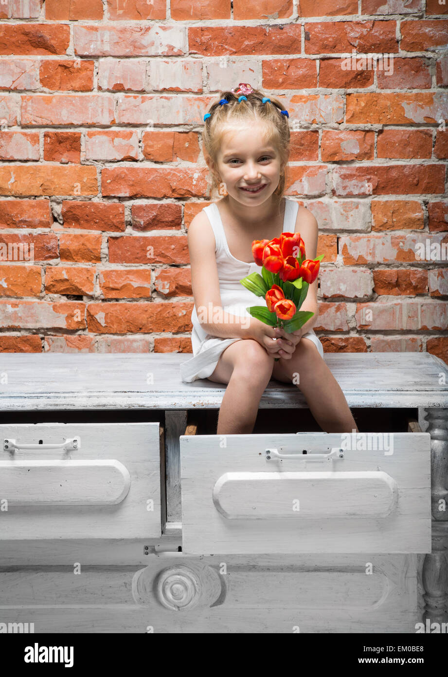 little girl with a bouquet of flowers Stock Photo - Alamy