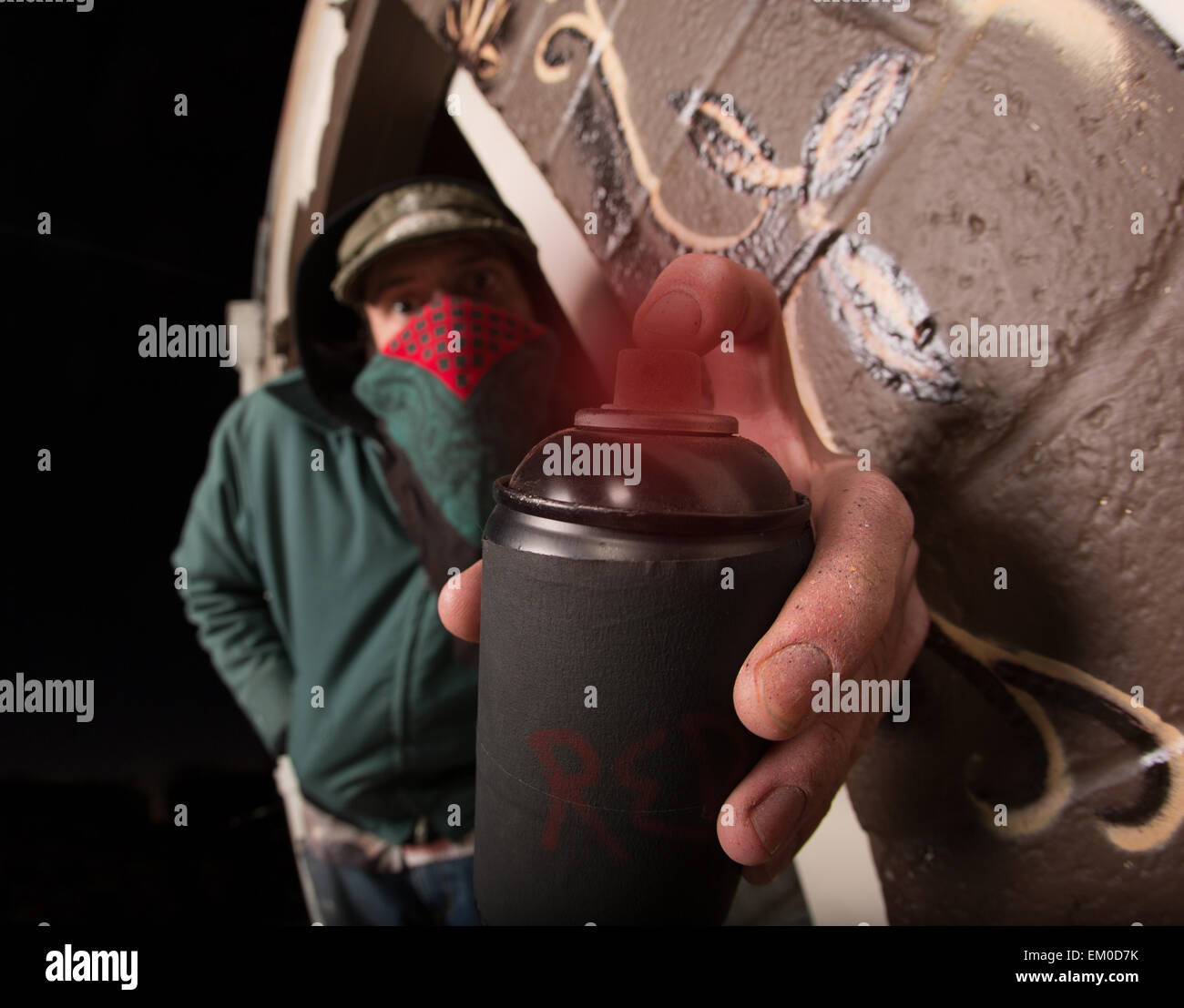 Man with Hood and Spray Paint Stock Photo Alamy