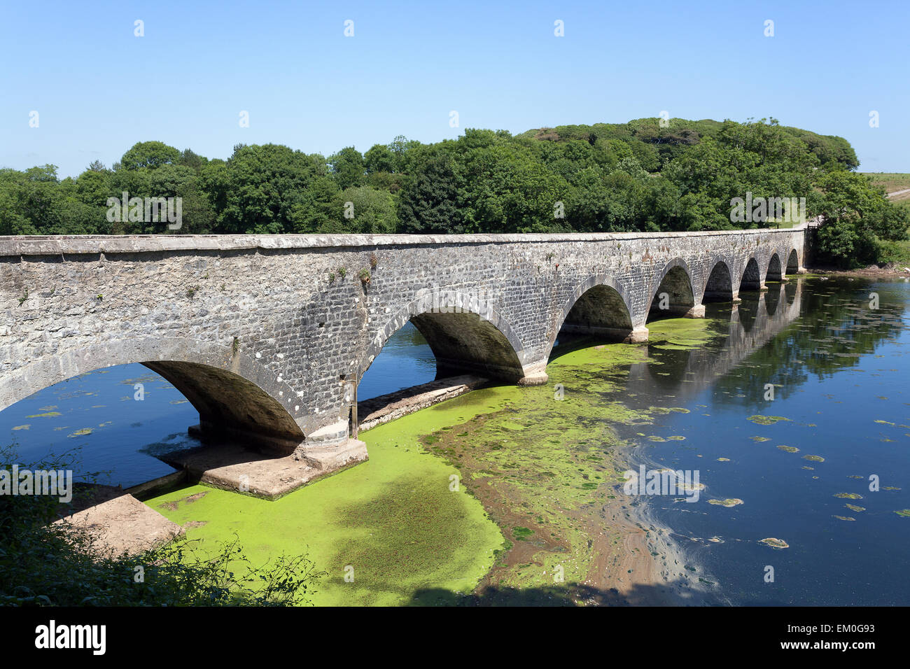Stone Eight arch bridge over Bosherston lakes, Pembrokeshire, Wales ...