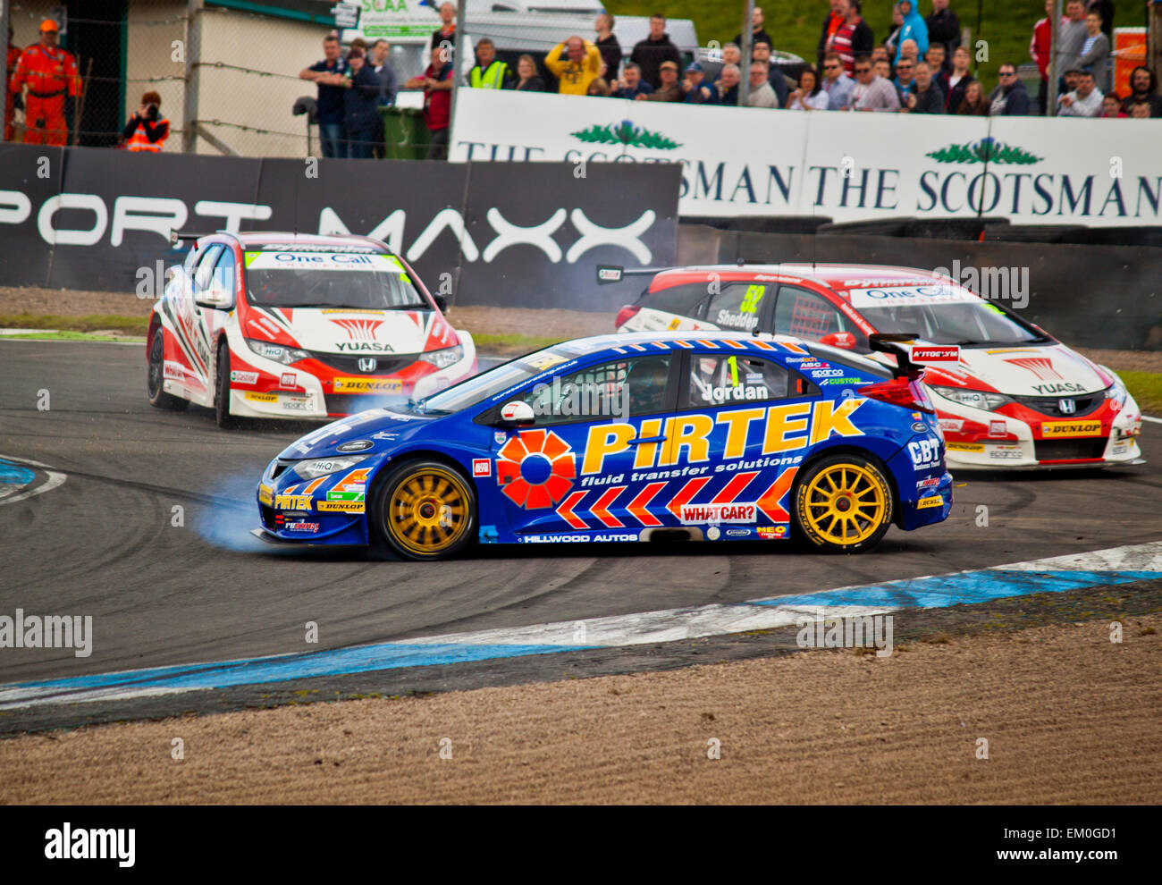 Andrew Jordan in a spin due to Honda Yuasa Racings Gorden Sheddon challenge for first place at Knochhill BTCC 2014 Stock Photo