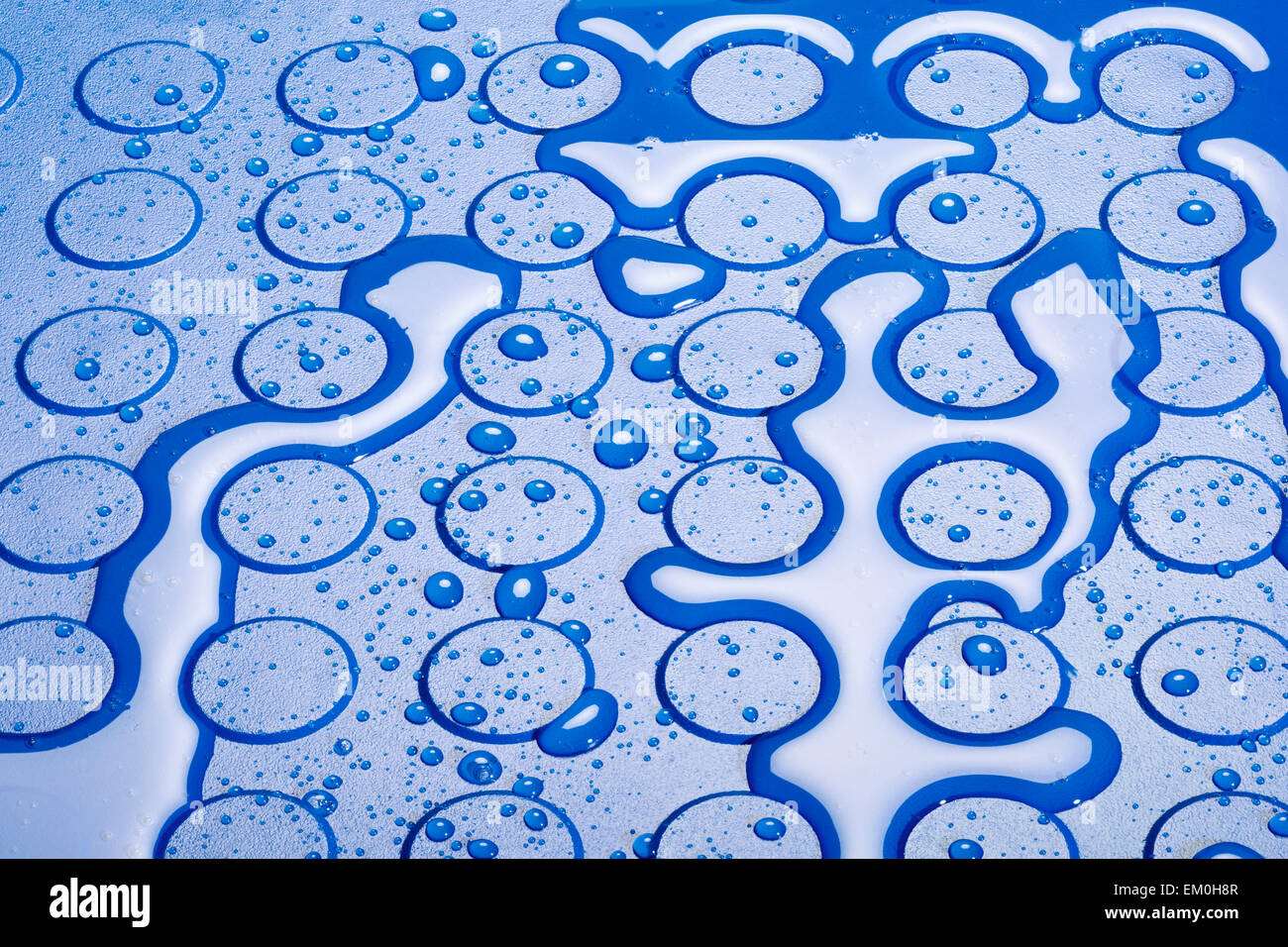 water drops and puddles on a studded vinyl flooring Stock Photo