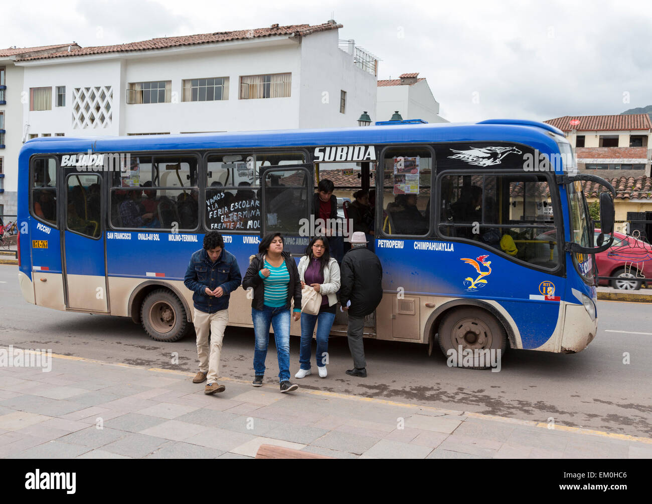Peru, Cusco.  Local Transport.  Passengers Disembarking from Local Bus. Stock Photo