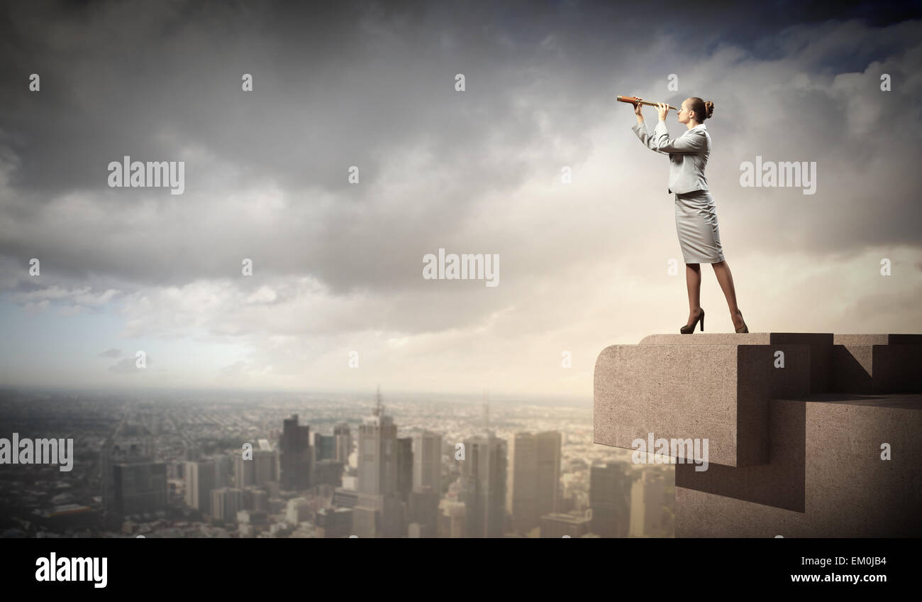 Business woman with telescope Stock Photo - Alamy