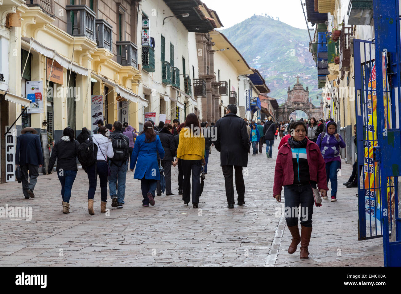 Peru, Cusco.  Pedestrian Street Leading to Santa Clara Arch (Arco de Santa Clara) in Background. Stock Photo