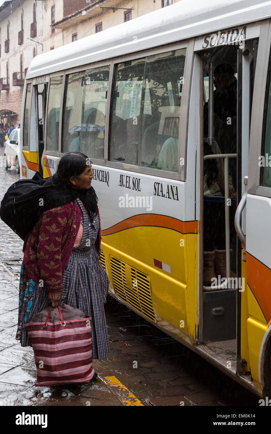 Peru, Cusco.  Old Woman Inquiring about Bus Destination. Stock Photo