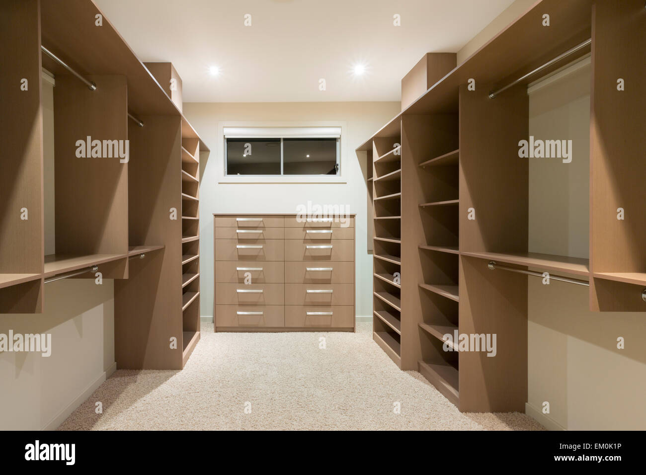 https://c8.alamy.com/comp/EM0K1P/big-empty-walk-in-wardrobe-in-luxurious-house-EM0K1P.jpg