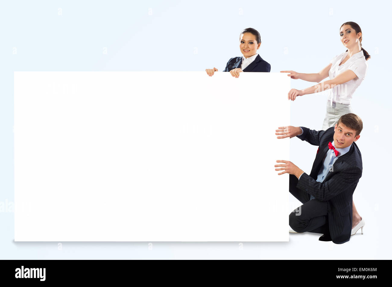 small group of people holding a blank banner Stock Photo - Alamy