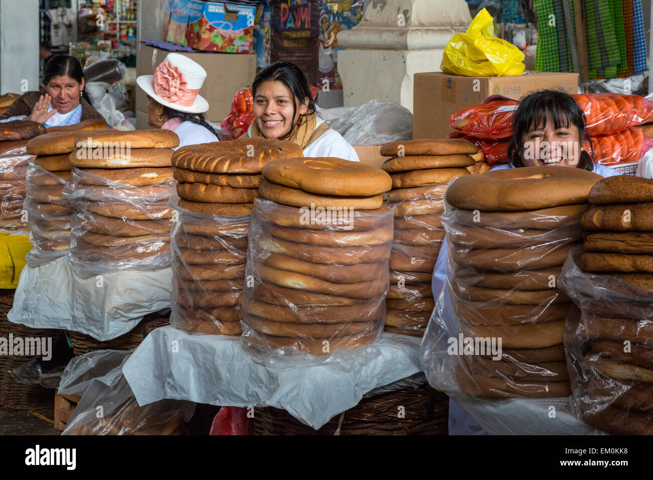 Peru, Cusco, San Pedro Market.  Peruvian Women Selling Bread. Stock Photo