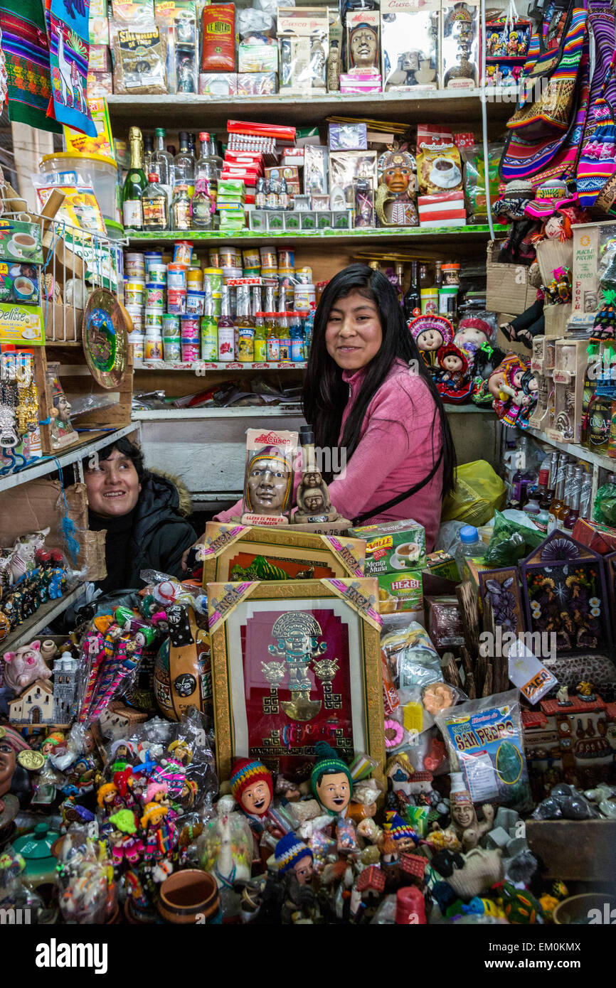 Peru, Cusco, San Pedro Market.  Young Woman and her Mother in Shop Selling Sundry Items. Stock Photo