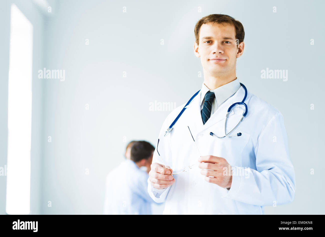 portrait of successful young doctor Stock Photo - Alamy