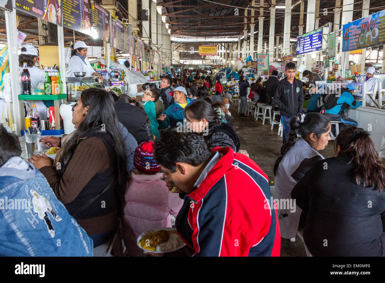 Peru, Cusco, San Pedro Market.  People Eating in the Food Court Area of the Market. Stock Photo