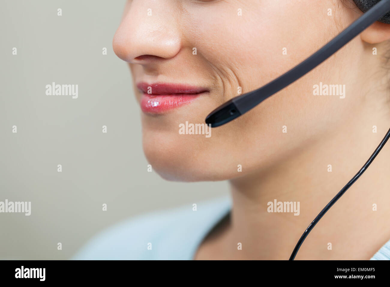 Female Call Center Employee Using Mic In Office Stock Photo Alamy