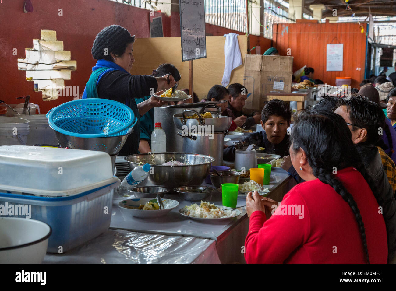 Peru, Cusco, San Pedro Market.  People Eating in the Food Court Area of the Market. Stock Photo