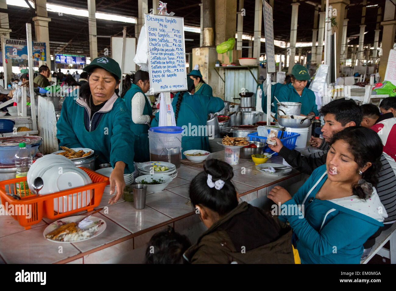 Peru, Cusco, San Pedro Market.  Customers Eating in the Food Court Area of the Market. Stock Photo