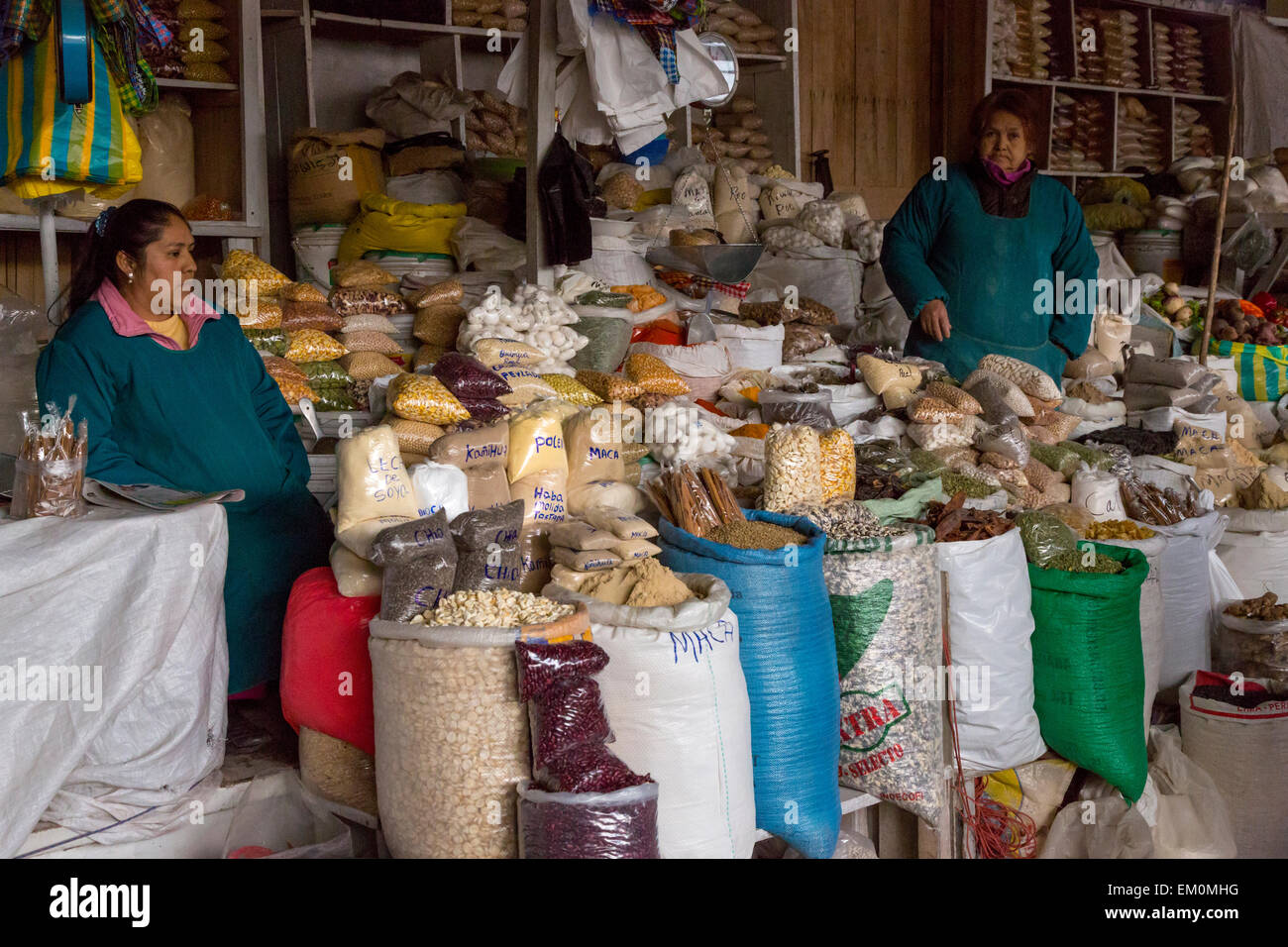 Peru, Cusco.  San Pedro market Women Selling Corn (Maize) and Grains. Stock Photo