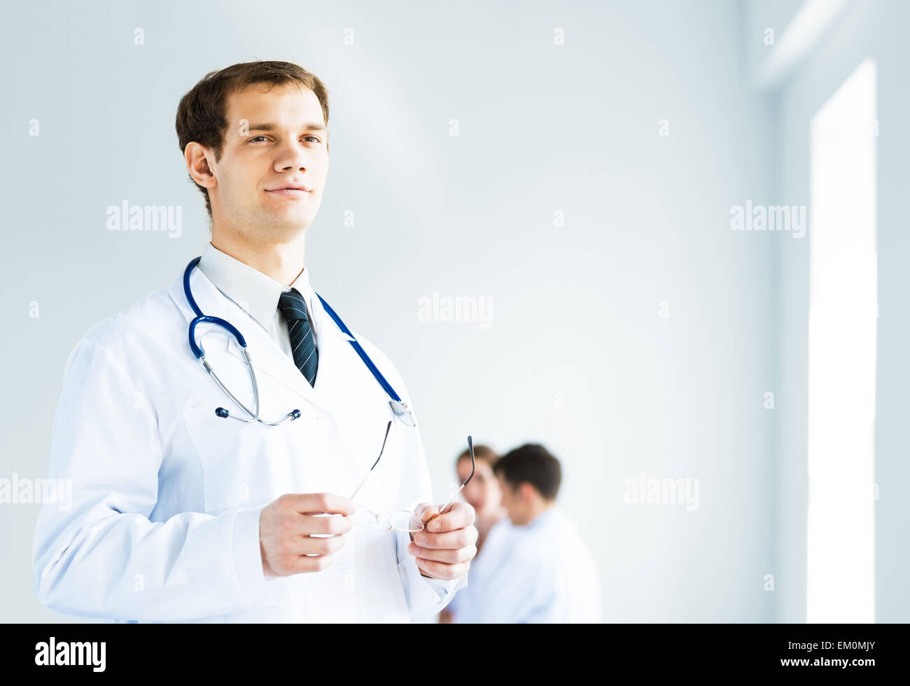 portrait of successful young doctor Stock Photo - Alamy