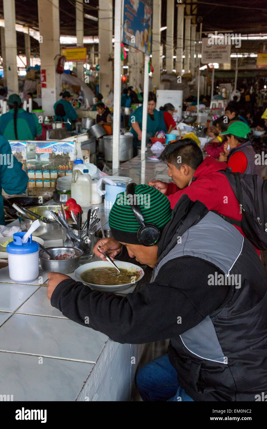 Peru, Cusco, San Pedro Market.  Customers Eating in the Food Court Area of the Market. Stock Photo