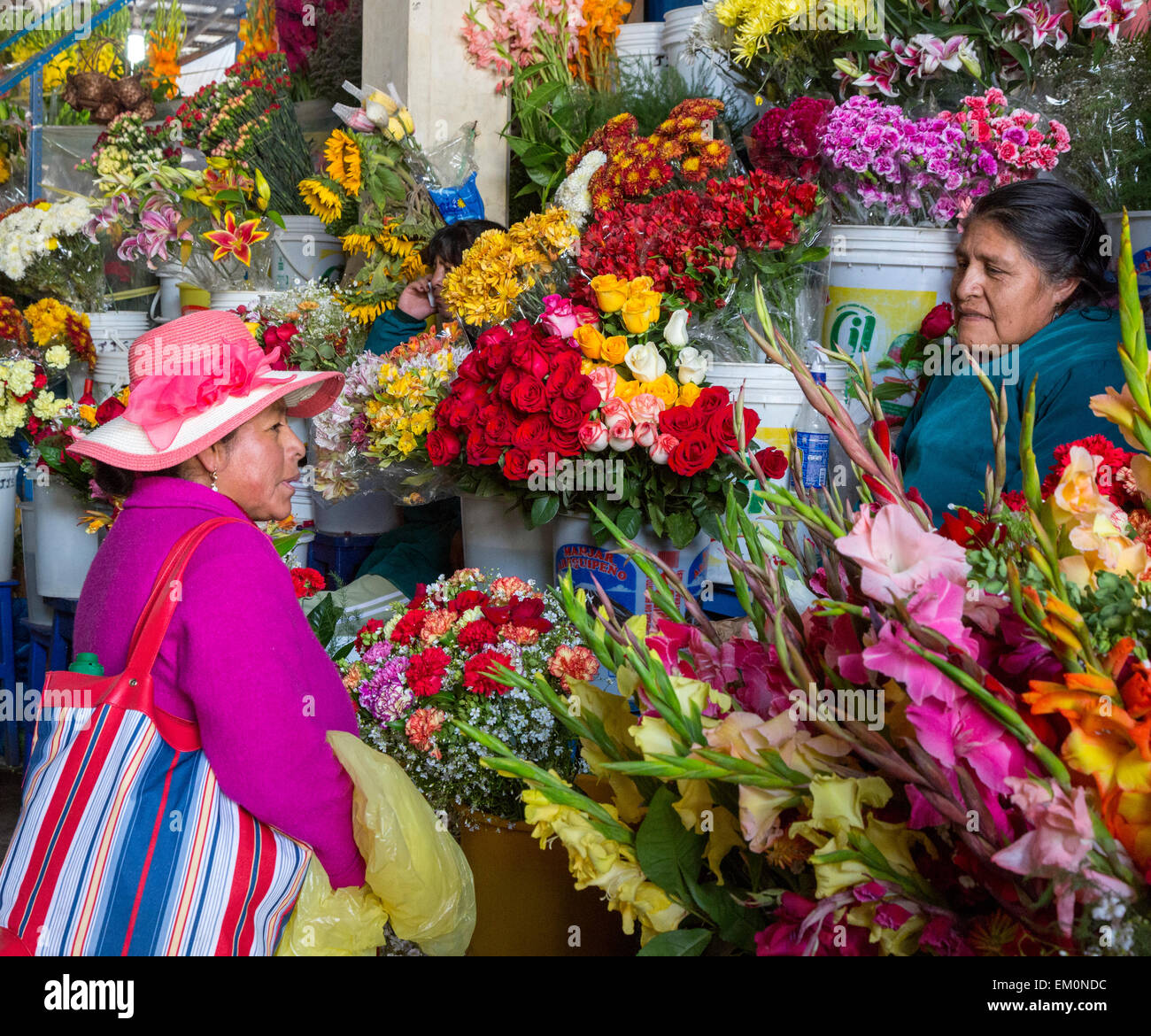 Peru, Cusco.  San Pedro Market.  Flower Vendor and Customer. Stock Photo