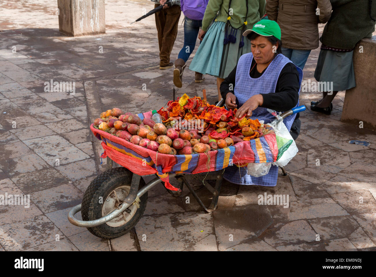 Peru, Cusco.  San Pedro Market.  Woman Selling Prickly Pear (Opuntia) Fruit. Stock Photo