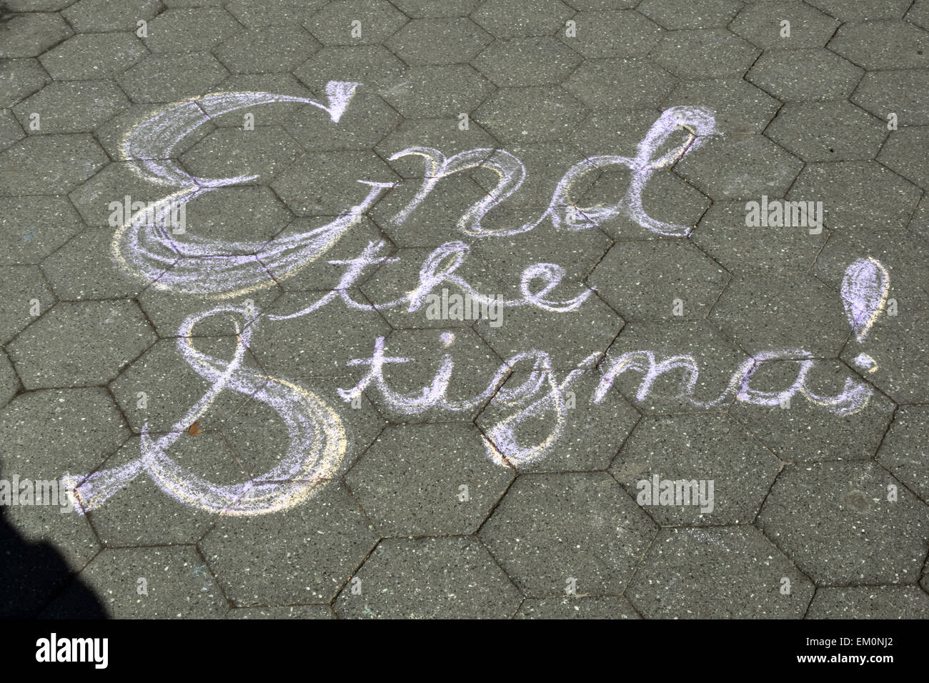 END THE STIGMA, a chalk drawn sign in Washington Square Park, urging understanding of AIDS. New York City. Stock Photo